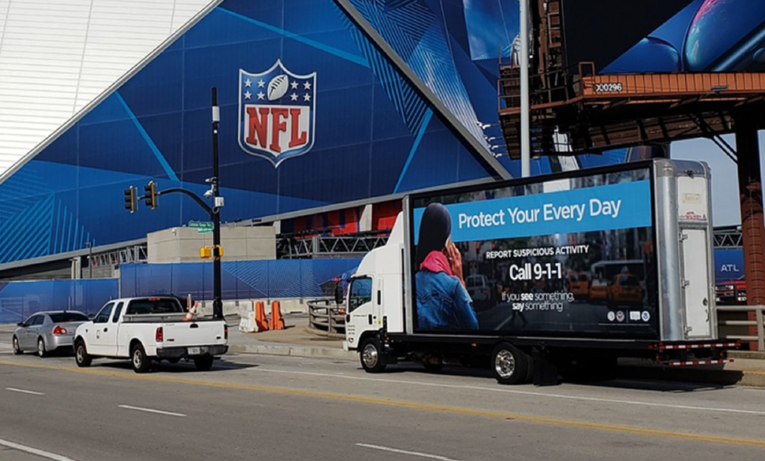 SeeSay Mobile Billboard driving by Mercedes Stadium