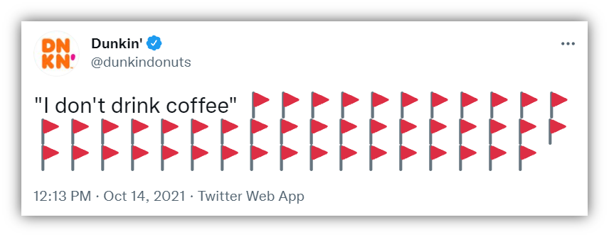 A tweet from Dunkin' Donuts reading "I don't drink coffee" followed by a lot of red flag emojis.